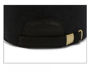 Detail of adjustable metal buckle and strap on winter wool baseball cap back
