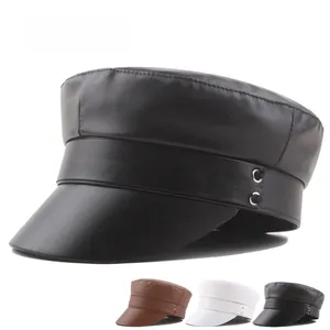 Detail of leather flat top navy hat with metal eyelets in black, brown and white colors