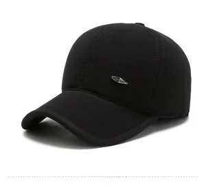 Detailed side view of black wool winter baseball cap with silver fashion metal plate