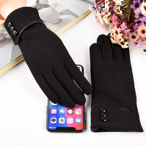Detail of thermal black knit gloves with three buttons and touchscreen fingertip feature