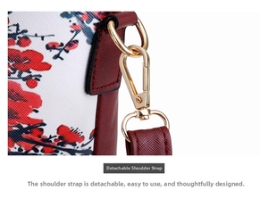 Detail view of the detachable shoulder strap with golden metal hook on graffiti bag