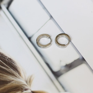 Minimalist silver round huggie hoop earrings with high-polished stainless steel finish