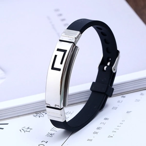 Black silicone bracelet with silver steel plate featuring a Greek key fret pattern