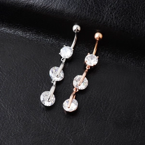Silver and rose gold belly rings with three round cubic zirconia on black leather