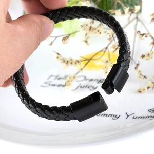 Men's vintage braided leather bracelet in black featuring a secure magnetic metal clasp