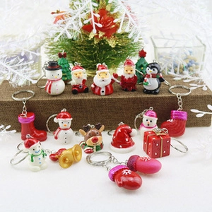 Collection of Christmas PVC keychains featuring Santa, snowman and reindeer ornaments