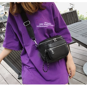 Detail der wasserdichten schwarzen Leder-Gürteltasche mit mehreren Reißverschlüssen