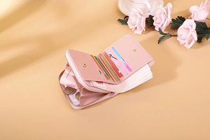 Detail view of pink PU leather wallet showing multiple card slots and gold zipper pocket