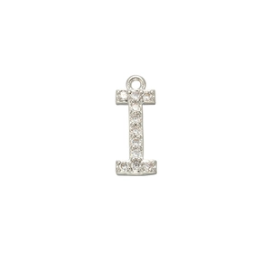 Macro shot of silver letter I pendant with micro-pave cubic zirconia on white background