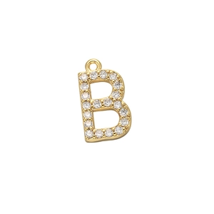 Macro shot of gold letter B pendant with micro-set clear zircon stones and top loop