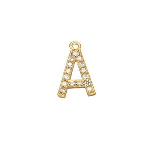 Close-up of gold letter A pendant with micro-pave zircons on a white background