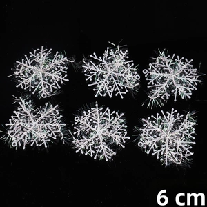Detail view of 6cm white glittery plastic snowflakes for Christmas tree decoration