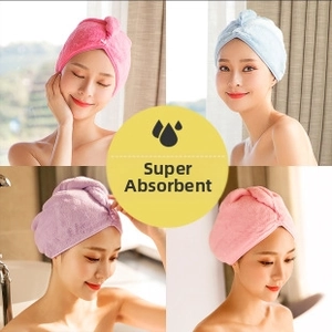 Close-up of microfiber hair towels with secure button closure in four bright colors