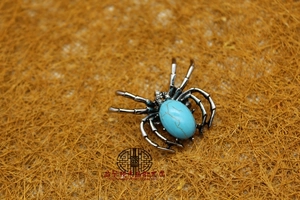 Spider brooch pendant with light blue turquoise-style stone in silver alloy setting