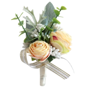 Elegant champagne rose boutonniere with eucalyptus leaves and white ribbon bow