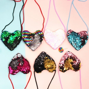Kids heart-shaped sequin crossbody bags with reversible sequins and slim cord straps