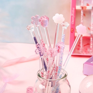 Pink glass stir sticks with cherry blossom and cat paw tops for coffee and juice