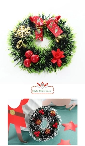 Detailed view of Christmas tinsel wreaths with red plaid bows and golden bells