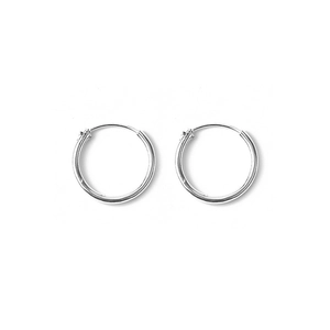 Detail view of silver minimalist circle hoop earrings in a sleek metallic finish