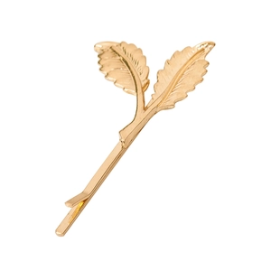 Minimalist golden leaf hair clip featuring detailed maple leaf design on white background