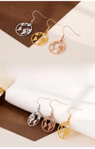 Detailed view of hollow world map earrings in silver, gold, and rose gold stainless steel