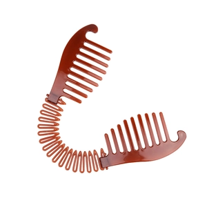 Brown amber plastic banana hair clip with interlocking teeth for ponytail styling