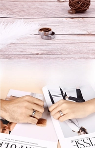 Detail of stainless steel heart puzzle rings showing matte finish and zircon inlay