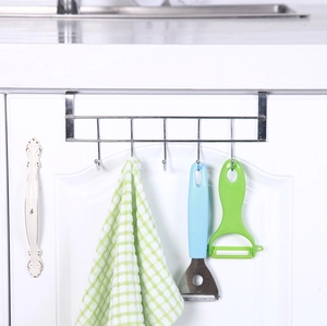 Close-up of a 5-hook over-the-door stainless steel rack holding kitchen utensils