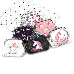 Close-up of assorted unicorn coin purses with vintage metal clasps in various colors