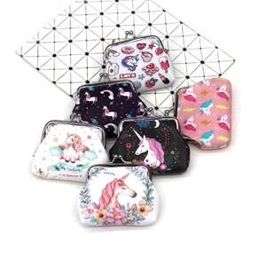 Detailed view of colorful unicorn coin purses with metal clasps and diverse cartoon prints