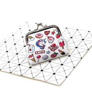 Detail of unicorn coin purse with colorful cupcake prints and silver metal clasp