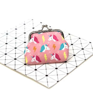 Pink unicorn canvas coin purse with metal kiss-lock closure on geometric background