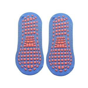 Blue low-cut cotton yoga socks with orange anti-slip silicone grips on bottom