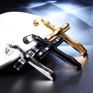 Detailed view of stainless steel cross pendants in gold, silver, and black finishes