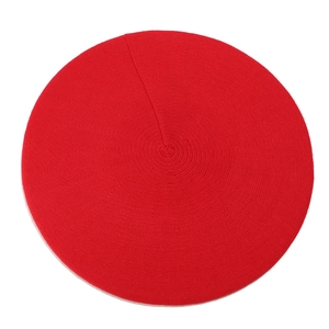 Top-down view showing the fine knit texture and vibrant red color of this wool beret