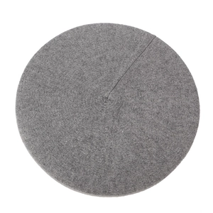 Detailed top view of the medium gray knitted wool beret with fine texture and round shape
