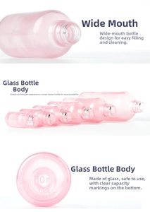 Close-up of pink frosted glass bottle base showing 50ml capacity mark and wide mouth