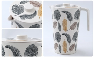 Detail of eco-friendly bamboo fiber pitcher with tropical leaf pattern and lid