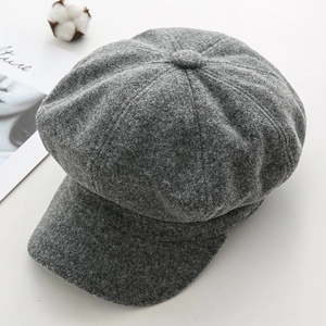 Detailed top view of dark grey wool octagonal newsboy hat with soft felt texture and decor