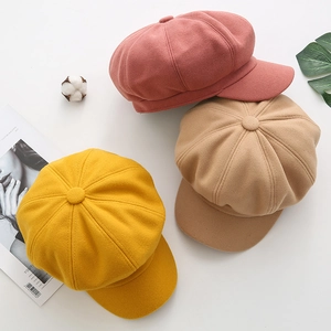 Classic solid color wool newsboy caps for women in pink, khaki, and yellow