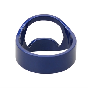 Macro detail of dark blue metal bottle opener ring with a smooth lacquer finish