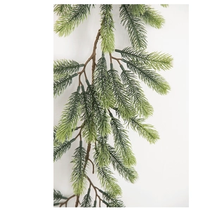 Detail showing dense faux pine needles on Christmas garland with natural green gradient