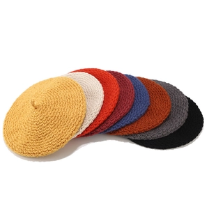 Hand-knitted vintage beret hats in eight colors including ginger, beige and navy blue