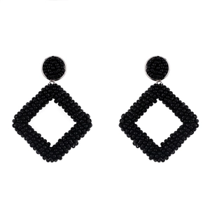 Detail of handmade black seed bead geometric earrings with hollow rhombus dangle design