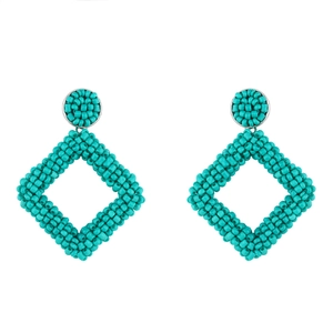Detailed view of turquoise handmade seed bead woven geometric rhombus drop earrings
