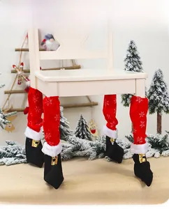 Close-up of red and black Christmas elf chair leg covers with snowflake patterns and buckles