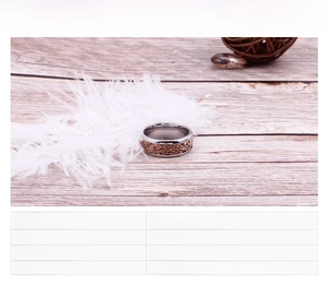 Detailed view of silver and rose gold stainless steel ring with hollow pattern inlay