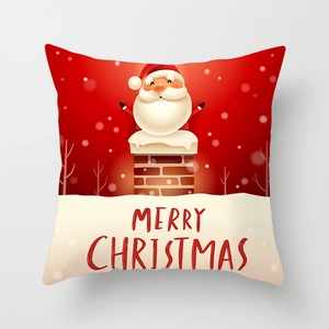 Close-up of Santa Claus emerging from chimney on red Christmas pillowcase