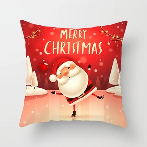 Detail of red Christmas pillowcase featuring a cartoon Santa Claus and Merry Christmas text