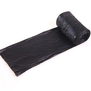 Thickened black roll-type garbage bags for kitchen use on white background